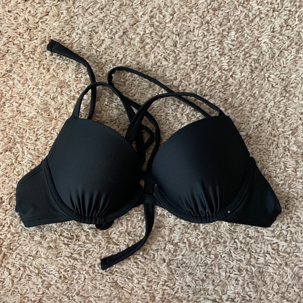 Black bikini top. Back is cross cross. Size 34A.